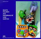 Bunte Figuren aus Papiermache und Karton